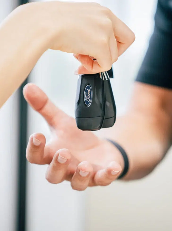 keys are being handed over after a financing agreement in Seattle